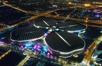 Night view of National Exhibition and Convention Center in Shanghai