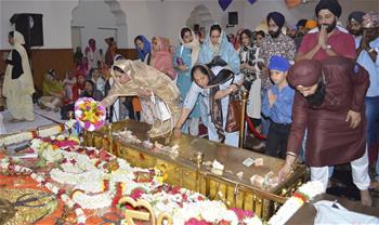 Indian Sikhs pray during religious festival in Bangalore